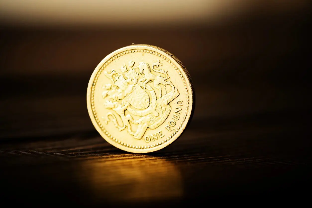 pound GBP coin on the desk